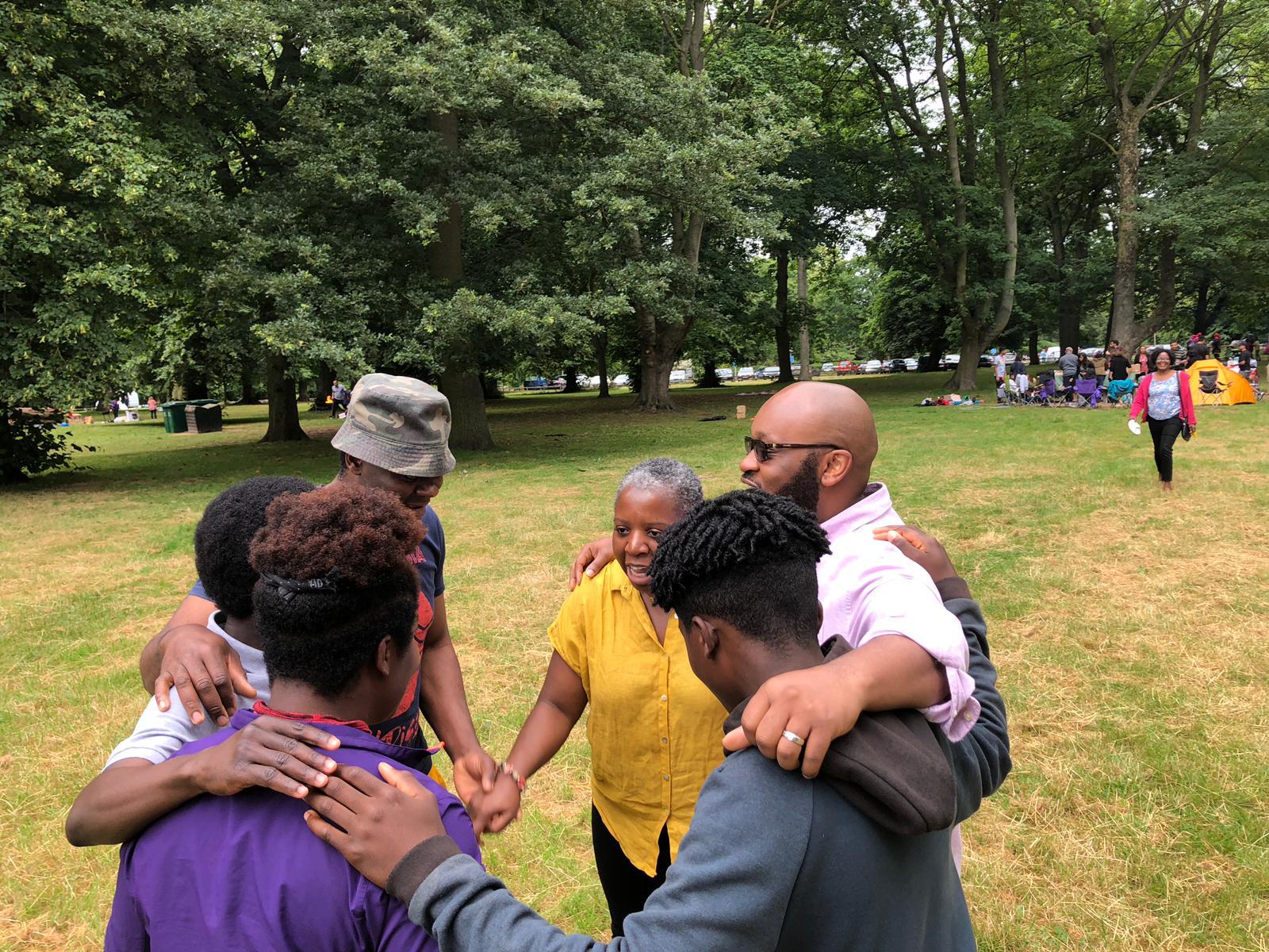 Praying together with hands laid on